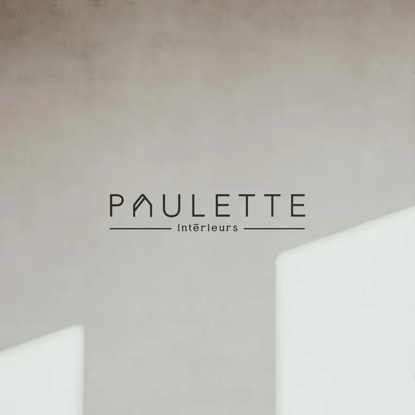 Logo Paulette intérieurs sur mur en béton.