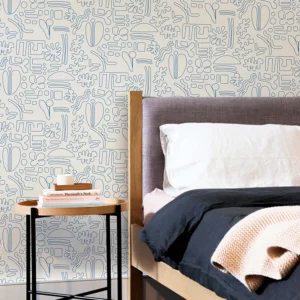 Papier peint au design épuré avec ses motifs géométriques tracés au trait bleu et fond blanc.