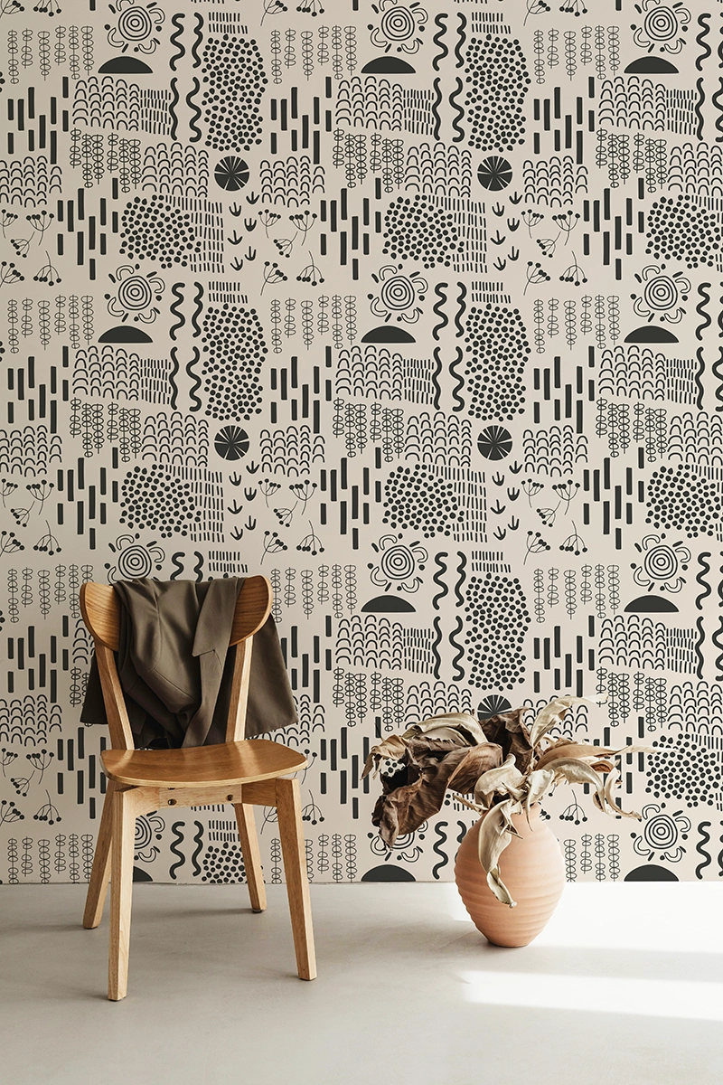 Papier peint écologique aux motifs géométriques aborigènes noirs sur fond blanc cassé.
